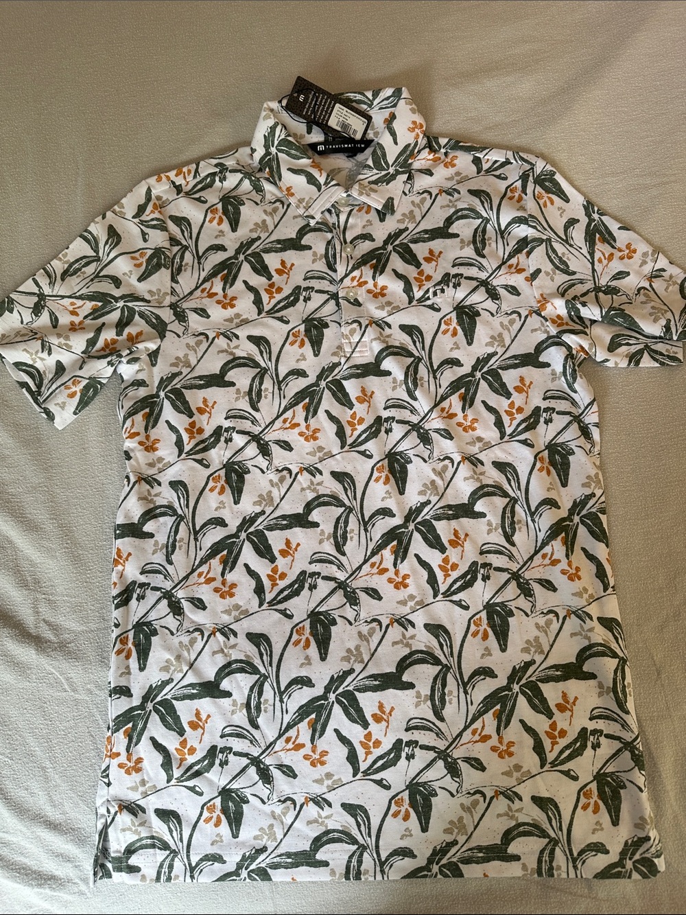 Travis Matthew active lifestyle, golf polo size small. Hawaiian floral print.